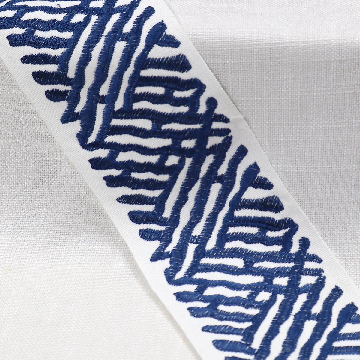 Mag Fabrics 11458 TRELLI EMB TAPE MARINE Fabric - Image 2